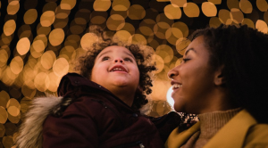 Woman and child looking at lights